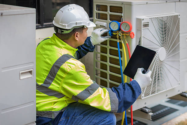 Professional Air Conditioning Repair technician working in Sheboygan Falls, WI